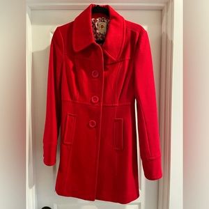 Red, medium sized, pea coat.